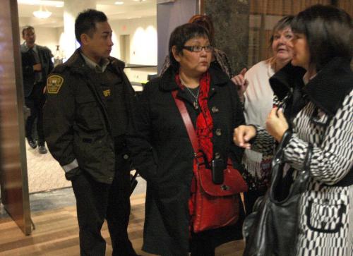 Delores Chief Abigosis, centre in red, a social worker testified today at the Phoenix Sinclair Inquiry Here she prepares to leave for a lunch break- See Carol Sanders story- November 26, 2012   (JOE BRYKSA / WINNIPEG FREE PRESS)
