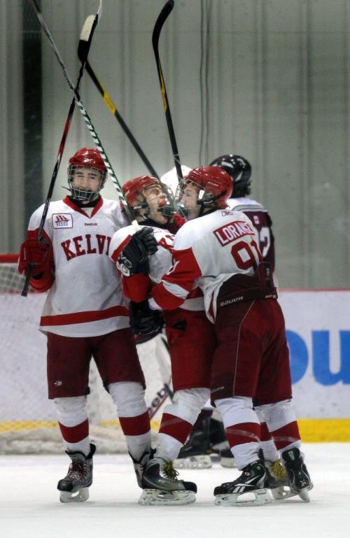 Kelvin CLipper #89 SCott Douglas (center) celebrates with #11 Dylan Allary  (left) and  #91 Mike Lorange after he scored the teams opening point to tie St Paul's at 1-1 in the first period of playoff finals Monday. See story. March 6, 2012 - (Phil Hossack / Winnipeg Free Press)