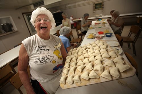 Perogy Club at St. Ivan Suchavsky Uk Orthodox cathedral, Doris Skakun, 90, who's been making perogies there every week since 1967 holds a wooden tray of perogies to be cooked before packaging. See Redekop story. June8, 2012 - (Phil Hossack Winnipeg Free Press)