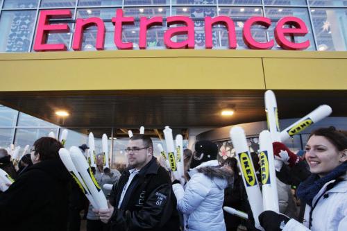 IKEA employees use thunder sticks to get the crowd going minutes before the opening.   121128 November 28, 2012 Mike Deal / Winnipeg Free Press