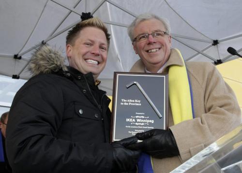 Manitoba Premier Greg Selinger hands over the "allen key" to the province to Store Manager of Ikea Winnipeg, Stephen Bobko, during the grand opening of Winnipeg's IKEA Wednesday morning. 121128 - Wednesday, November 28, 2012 -  (MIKE DEAL / WINNIPEG FREE PRESS)
