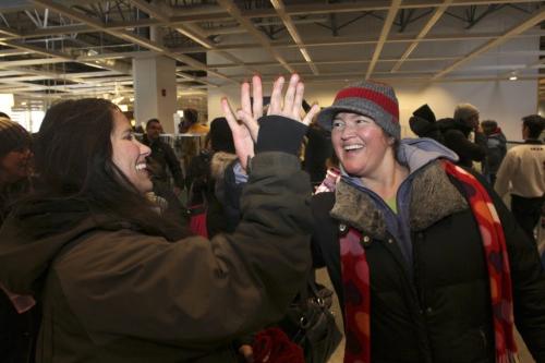 Kerri Lambert and Carrie McLeod high five after finally getting into the store during the grand opening of Winnipeg's IKEA Wednesday morning. 121128 - Wednesday, November 28, 2012 -  (MIKE DEAL / WINNIPEG FREE PRESS)