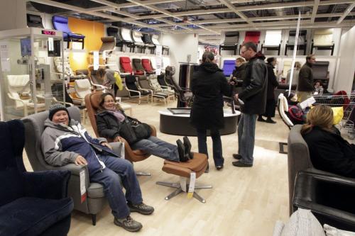 Customers take a seat in the showroom after standing in line for hours shortly after the grand opening of Winnipeg's IKEA Wednesday morning. 121128 - Wednesday, November 28, 2012 -  (MIKE DEAL / WINNIPEG FREE PRESS)