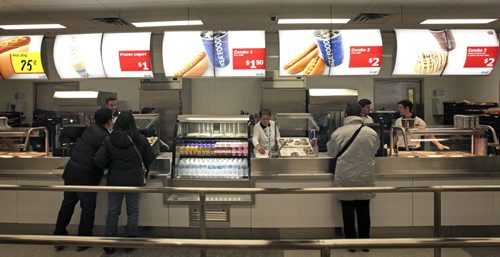 Customers stand in line to purchase hotdogs and drinks for $1.50 shortly after the grand opening of Winnipeg's IKEA Wednesday morning. 121128 - Wednesday, November 28, 2012 -  (MIKE DEAL / WINNIPEG FREE PRESS)