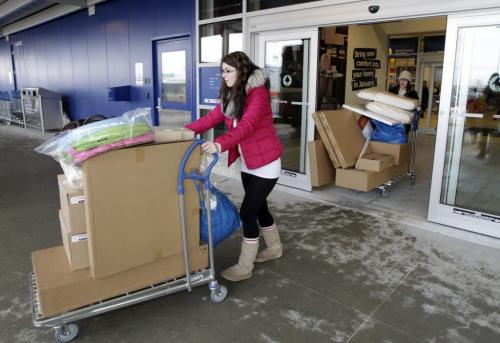 Terri Seguin and Kristy Lanauze make their way towards the exit after the grand opening of Winnipeg's IKEA Wednesday morning. 121128 - Wednesday, November 28, 2012 -  (MIKE DEAL / WINNIPEG FREE PRESS)