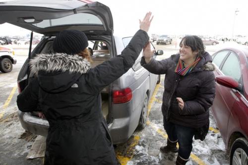 Lisa Stunner (left) and Sarah Kelly (right) high five after managing to fit all their purchases into the car, which included a couch and a wardrobe, after the grand opening of Winnipeg's IKEA Wednesday morning. 121128 - Wednesday, November 28, 2012 -  (MIKE DEAL / WINNIPEG FREE PRESS)