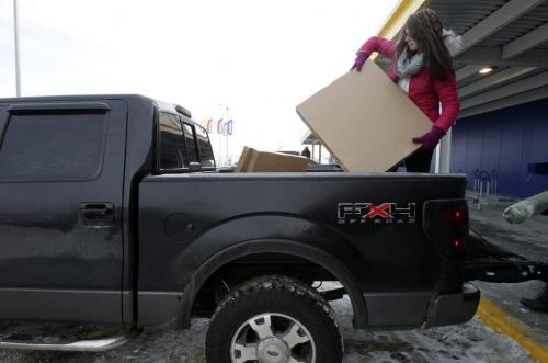Terri Seguin from Sioux Lookout, Northwestern Ontario, loads up her truck after the grand opening of Winnipeg's IKEA Wednesday morning. 121128 - Wednesday, November 28, 2012 -  (MIKE DEAL / WINNIPEG FREE PRESS)