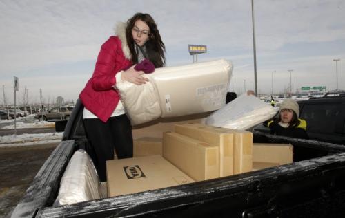 Terri Seguin (left) and Kristy Lanauze (right) from Sioux Lookout, Northwestern Ontario, loads up the truck after the grand opening of Winnipeg's IKEA Wednesday morning. 121128 - Wednesday, November 28, 2012 -  (MIKE DEAL / WINNIPEG FREE PRESS)