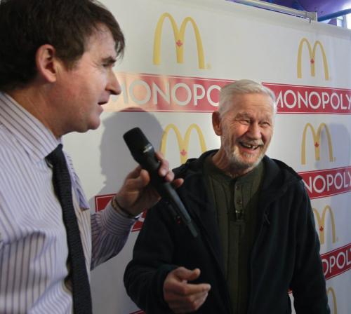 At right, Bob Curle of Selkirk, Manitoba was introduced Thursday as the winner of the $1,000,000 prize in the McDonald's 2012 Monopoly Game by Barry Bruce, owner of the McDonald's restaurant in Selkirk,Mb. where Bob purchased his large coffee that had the grand prize "collect and win'' game stamps. He hasn't decided what to do with the winnings yet. The chances that both stamps were on one cup needed to win the million dollar prize were about 1 in 307 million.    (WAYNE GLOWACKI/WINNIPEG FREE PRESS) Winnipeg Free Press  Nov. 29   2012