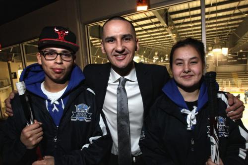 Kevin Chief (centre) Minister of Children and Youth Opportunities with After School Leaders, Justyce Davey from the University of Winnipeg Collegiate and Kiana Beaudry from St. John's High School at the provincial announcement of the new After School Leaders Program.  121129 November 29, 2012 Mike Deal / Winnipeg Free Press