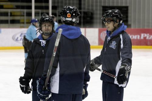 After School Leaders, Justyce Davey (right) from the University of Winnipeg Collegiate and Kiana Beaudry (left) from St. John's High School on the ice with another instructor during the Winnipeg Jets Hockey Academy after the provincial announcement of the new After School Leaders Program.  121129 November 29, 2012 Mike Deal / Winnipeg Free Press