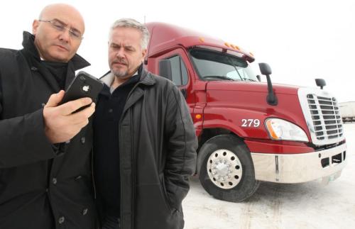MICHEL AZIZA, left and HANS PEPER , managing partners of Traffilog North America Inc., the North American operations of an Israeli-based company which offers a cell-phone and web-based fleet management services for trucking firms and other transporation companies.  They pose for image at Schroeder Freight Inc.on Hyw 75 South-See Murray McNiell story-November 29, 2012   (JOE BRYKSA / WINNIPEG FREE PRESS)