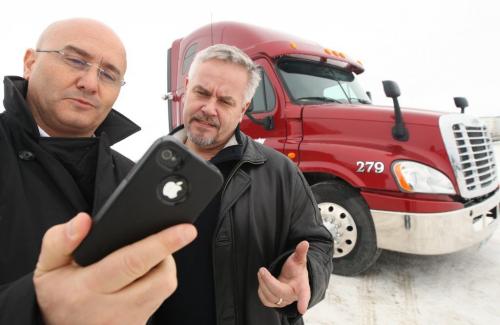 MICHEL AZIZA, left ,and HANS PEPER , managing partners of Traffilog North America Inc., the North American operations of an Israeli-based company which offers a cell-phone and web-based fleet management services for trucking firms and other transporation companies.  They pose for image at Schroeder Freight Inc.on Hyw 75 South-See Murray McNiell story-November 29, 2012   (JOE BRYKSA / WINNIPEG FREE PRESS)