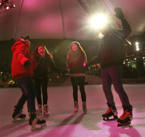 From left, Michael Natividad, Ria San Andres, Joanne Cutaran and Carl Saballa enjoy the mild temperature skating on the rink at The Forks Friday evening.  (WAYNE GLOWACKI/WINNIPEG FREE PRESS) Winnipeg Free Press  Nov. 30   201