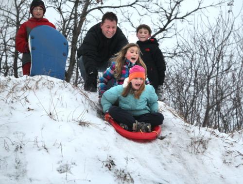 Mia Racano 10 yrs (hat, front) and Chayse Linnell 11 (purple paid) scream as they prepare to slide down the hill as Chayse's dad holds them back  at Silverfox Estates Hill, also known as "The Pit" Saturday. Also in photo are  Taegan Linnell 11 (red) and , Jacob Jubinville 11 (Black).  Hill is in town of Birds Hill. Standup photo   Dec 01, 2012, Ruth Bonneville  (Ruth Bonneville /  Winnipeg Free Press)