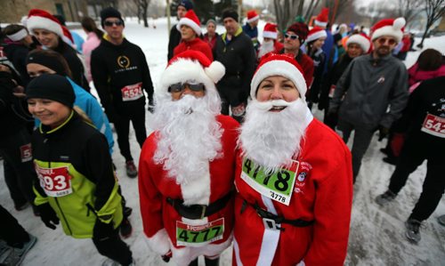 Clemus Laurila and Melanie Vanderhorst prepare to run the 5km Santa Shuffle at The Forks, Saturday, December 1, 2012. Proceeds from the run went to the Salvation Army. (TREVOR HAGAN/WINNIPEG FREE PRESS)