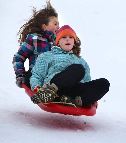Chayse Linnell 11 (purple paid, rear) and Mia Racano 10 yrs (hat) scream as they slide down the hill weather at Silverfox Estates in the town of Birds Hill Saturday. Standup photo Dec 01, 2012, Ruth Bonneville  (Ruth Bonneville /  Winnipeg Free Press)