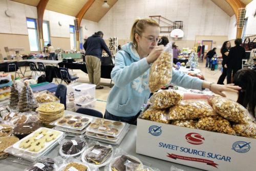 Cindy a volunteer baker puts out lots of goodies for the 2nd Annual Craig Street Cats Holiday Shopping Event at R. A. Steen community centre. Over 25 vendors have set up tables with items that range from food to clothing and of course some cat related items and will be open today until 4 P. M.  121202 December 02, 2012 Mike Deal / Winnipeg Free Press