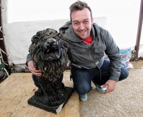 Nick Rogocki purchased this concrete lion for $60 at the Winnipeg Police Service's unclaimed goods auction Sunday afternoon at Associated Auto Auction on Roblin Blvd.  121202 December 02, 2012 Mike Deal / Winnipeg Free Press