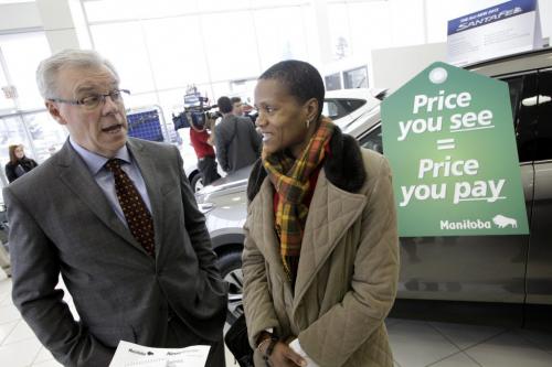 Preimer Greg Selinger and the acting director of consumer protection office, Beatrice Dyce, talk about the provincial anouncement that would provide proctection from sticker shock and false advertising for vehicle buyers at the Focus Hyundai car dealership on Nairn Ave. 121203 - Monday, December 03, 2012 -  (MIKE DEAL / WINNIPEG FREE PRESS)