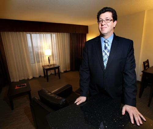 John Saad poses in one of the Place Louis Riel's "Executive Suites" Monday. See Murray McNeill's story, the Hotel is converting back to downtown Apartments.....Phil Hossack / Winnipeg Free Press - December 12, 2012