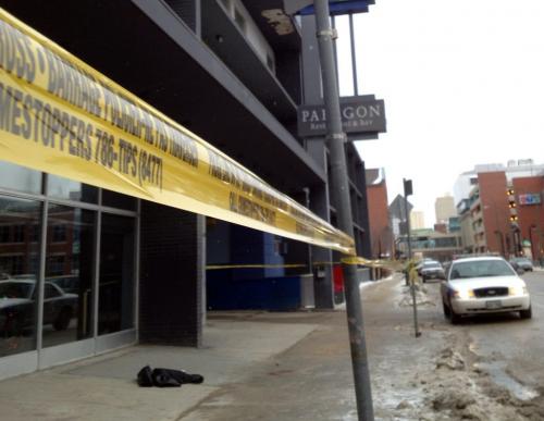 Winnipeg Police taped off a section of sidewalk containing a leather jacket and blood in front of the Carlton Inn at 220 Carlton St. Thursday morning.(WAYNE GLOWACKI/WINNIPEG FREE PRESS) Winnipeg Free Press  Dec.6   2012