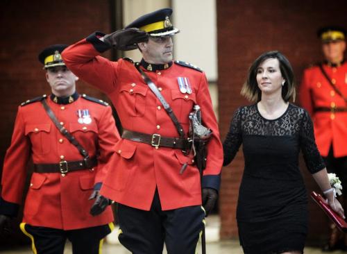 Assistant Commissioner Kevin Brosseau salutes the troops as he arrives with his wife Krista for the change of command ceremony as he becomes the commander of RCMP "D" Division at the Minto Armouries.  121206 December 06, 2012 Mike Deal / Winnipeg Free Press