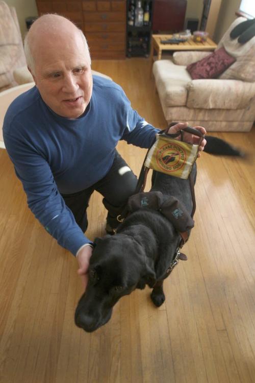 Shep Shell with his guide dog in his River Heights home-See Gabriel Giroday- December 06, 2012   (JOE BRYKSA / WINNIPEG FREE PRESS)