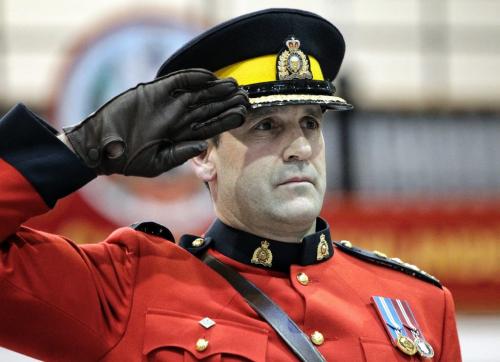 Assistant Commissioner Kevin Brosseau salutes the troops as they parade by after he was made the new commander of RCMP "D" Division during a change of command ceremony at the Minto Armouries. He replaces Assistant Commissioner Bill Robinson who now resides in Edmonton, Alberta.  121206 December 06, 2012 Mike Deal / Winnipeg Free Press