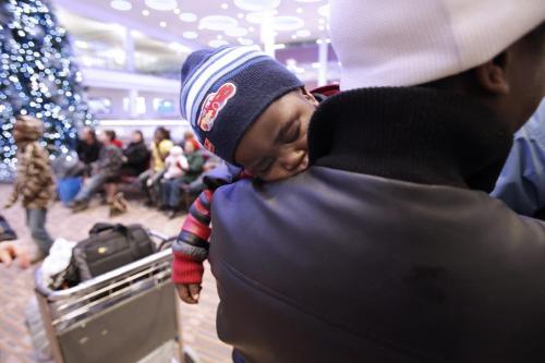 December 4, 2012 - 121204  -  A youngster takes a nap while he awaits the arrival of Congolese refugee Bahati Mulimbwa and his family at Winnipeg's James Richardson International Airport Tuesday December 4, 2012. The family of nine fled the Congo in 2002 and have been sponsored into Canada by First Presbyterian Church. John Woods / Winnipeg Free Press