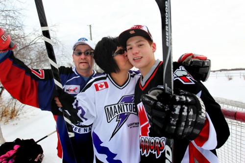 Farron Cochrane, his wife Pearl and their 15 year old son Christian enjoy and pick up game of hockey on their driveway in Pequis  First Nation.  The Cochrane family have nine children and with 6 of them playing hockey in local leagues.  See Randy Turner's Native, Aboriginal hockey story. Dec 05, 2012, Ruth Bonneville  (Ruth Bonneville /  Winnipeg Free Press)