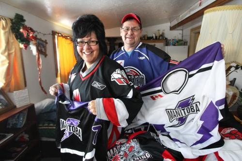 Farron Cochrane and his wife Pearl laugh, giggle and kiss as they look through all their son Ralph's hockey jerseys in their home on Peguis First Nation. See Randy Turner's Native, Aboriginal hockey story. Dec 05, 2012, Ruth Bonneville  (Ruth Bonneville /  Winnipeg Free Press)
