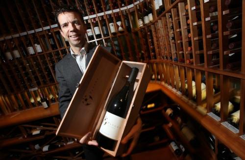Tom Bima, manager of the WineHouse, shows off one of the more expensive bottles he expects to sell over the holidays... See Geoff Kirbyson's story. .... December 7, 2012 - (Phil Hossack / Winnipeg Free Press)