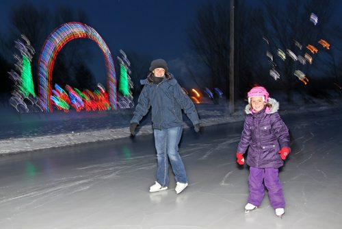 Brandon Sun 07122012 Julie Palidwar and her daughter Paige, 6, are the first to hit the ice after the City of Brandon Skating Oval just west of 18th St. on McGregor Ave. officially opened for the season on Friday afternoon.  (Tim Smith/Brandon Sun)