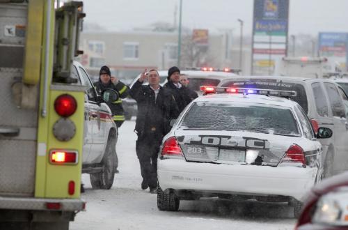 Emergency personal vehicles line up just on Ellice Ave. just east of the St. James intersection after a MVC Saturday afternoon.  Some motorists were seen being taken away in an ambulance. Standup weather photo. Dec 08, 2012, Ruth Bonneville  (Ruth Bonneville /  Winnipeg Free Press)