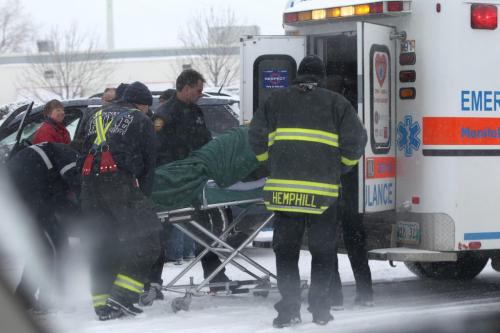 Emergency personal load a victim from a car accident which occurred at the corner of St. James Street and Ellice Ave. Saturday afternoon.  Standup weather photo. Dec 08, 2012, Ruth Bonneville  (Ruth Bonneville /  Winnipeg Free Press)