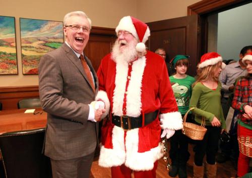 Santa was just one of the many visitors  to the  Manitoba  legislature annual open house Saturday afternoon.  Santa and his elves make a quick visit to Premier Greg Selinger's office. Standup weather photo. Dec 08, 2012, Ruth Bonneville  (Ruth Bonneville /  Winnipeg Free Press)