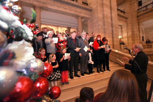 Premier Greg Selinger along with MLA"s and their families sing Christmas carols on the steps of the leg during the annual open house of the Manitoba  legislature Saturday afternoon.   Standup weather photo. Dec 08, 2012, Ruth Bonneville  (Ruth Bonneville /  Winnipeg Free Press)