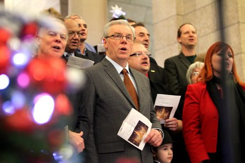 Premier Greg Selinger along with MLA"s and their families sing Christmas carols on the steps of the leg during the annual open house of the Manitoba  legislature Saturday afternoon.   Standup weather photo. Dec 08, 2012, Ruth Bonneville  (Ruth Bonneville /  Winnipeg Free Press)