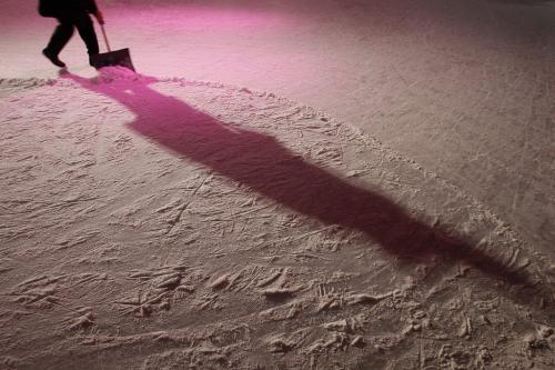 Ray (did not want last name used) clears the ice for skaters at the Forks Saturday, December 8, 2012. (John Woods/Winnipeg Free Press)