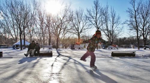 Chantal Ip, 10, practices some twirls at The Forks skating pond Sunday morning.  121209 December 09, 2012 Mike Deal / Winnipeg Free Press