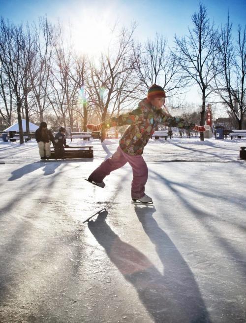 Chantal Ip, 10, practices some twirls at The Forks skating pond Sunday morning.  121209 December 09, 2012 Mike Deal / Winnipeg Free Press