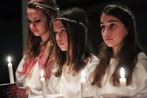 (L-r) Sonja Rempel, 15, Brielle Andrews, 12, and Elena Rempel, 12, take part in the Swedish Lucia pageant at the Scandinavian Centre Sunday afternoon. 
121209
December 06, 2012
Mike Deal / Winnipeg Free Press