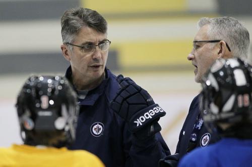 Winnipeg Jets coach Claude Noel and new assistant coach Perry Pearn (R) coach a minor league hockey camp at MTS Iceplex Monday, December 10, 2012. (John Woods/Winnipeg Free Press)