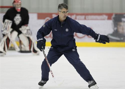 Winnipeg Jets coach Claude Noel coaches a minor league hockey camp at MTS Iceplex Monday, December 10, 2012. (John Woods/Winnipeg Free Press)