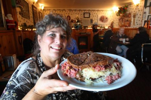 Tracy Konopada shows off her massive Reuben sandwich at her restaurant called Ludas at 410 Aberdeen -  See Marion Warhaft review - December 11, 2012   (JOE BRYKSA / WINNIPEG FREE PRESS)