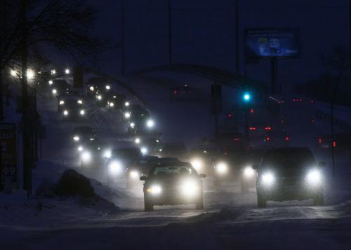 Snowy Drive- Cars crawl over the Slaw Rebchuk overpass Wednesday morning as driving conditions were tricky with the 5cm of snow that fell overnight in Winnipeg- Standup Photo- Dec 12, 2012   (JOE BRYKSA / WINNIPEG FREE PRESS)
