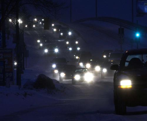 Snowy Drive- Cars crawl over the Slaw Rebchuk overpass Wednesday morning as driving conditions were tricky with the 5cm of snow that fell overnight in Winnipeg- Standup Photo- Dec 12, 2012   (JOE BRYKSA / WINNIPEG FREE PRESS)