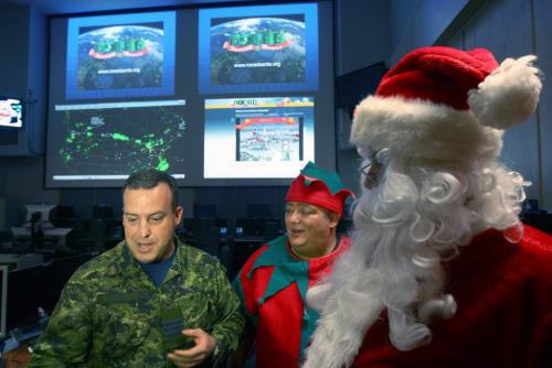 Today Santa was given a special pre-flight operational briefing by Lieut-Col Dave Dixon, left, with NORAD at 1 Canadian Air Division headquarters to plan out his route once he hits the east coast on Christmas. Pre-flight operational briefing will provide Santa Clause with a better understanding of what to expect from the Canadian NORAD Region as we prepare to track his magical journey once again- Standup Photo- Dec 12, 2012   (JOE BRYKSA / WINNIPEG FREE PRESS)