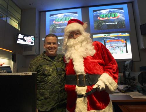 Today Santa was given a special pre-flight operational briefing by Lieut-Col Dave Dixon, left, with NORAD at 1 Canadian Air Division headquarters to plan out his route once he hits the east coast on Christmas. Pre-flight operational briefing will provide Santa Clause with a better understanding of what to expect from the Canadian NORAD Region as we prepare to track his magical journey once again- Standup Photo- Dec 12, 2012   (JOE BRYKSA / WINNIPEG FREE PRESS)